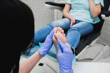 Professional pedicure using dieffenbach scalpel. Medical pedicure procedure using special...