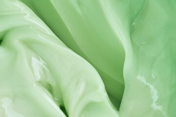 the texture of a moisturizing body cream. green liquid texture waves