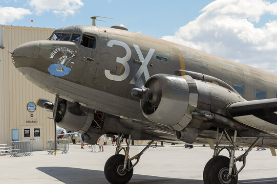Palm Springs Airport, CA, USA - March 25, 2021: this image shows C-47 Skytrain vintage military transport plane called 'What's up Doc?' arriving at the Palm Springs Air Museum.