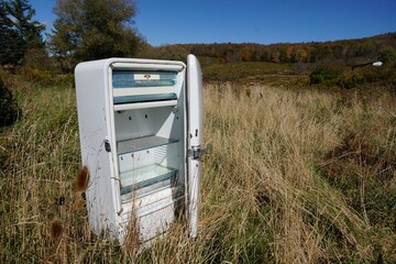 Delhi USA - 5 October 2014 - Old refrigerator in farm field