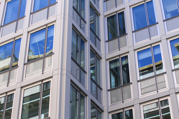 Office building in Rome, concrete structure, large reflecting windows.