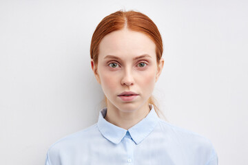 Confident beautiful young business woman standing isolated on white background. close up face headshot portrait