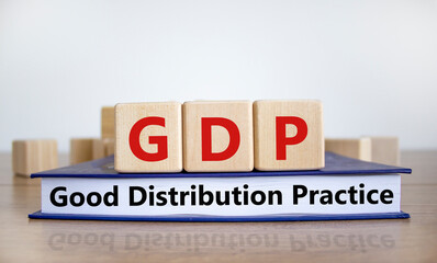 GDP, good distribution practice symbol. Concept words 'GDP, good distribution practice' on cubes on a beautiful white background. Business and GDP, good distribution practice concept. Copy space.