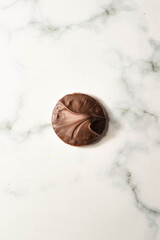 Tagalong cookies, copycat from girl scout's cookies. Made with chocolate and peanut butter on a shortbread cookie. White marble background
