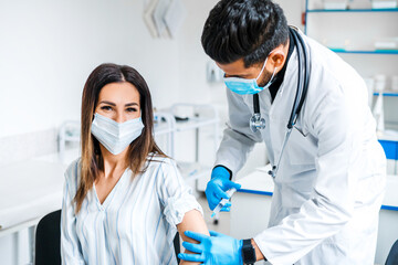 Vaccination against covid 19. Smiling patient during vaccination