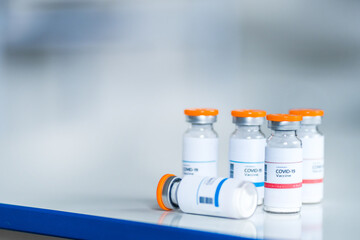 Ampoules with vaccine. Vaccine against covid 19, coronavirus, place for text