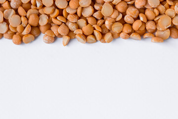 White background of dry pea grains. Top view, copy space.