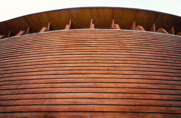 Abstract architecture. Close up of a wooden building facade.