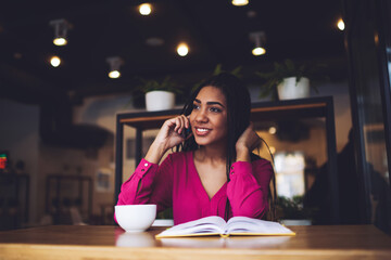 Happy African American woman making phone call
