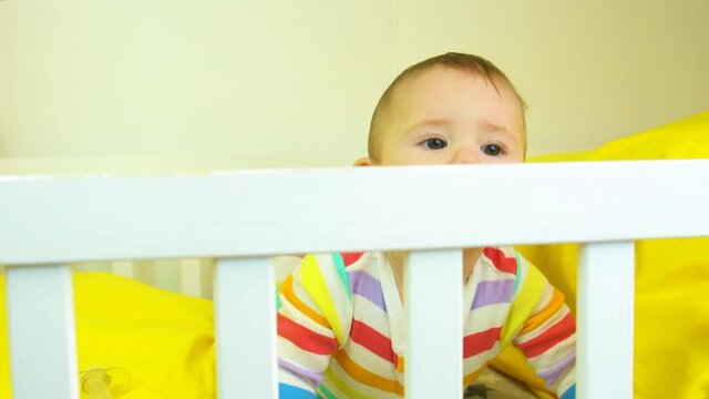 baby plays in the crib. selective focus.