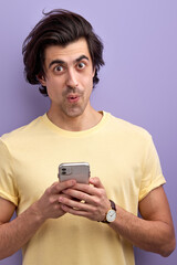 Young Male In Casual Wear Stand With Mobile Phone, Chatting, Reading Message
