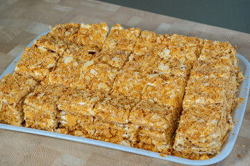 a large layer cake prepared by a chef in a restaurant for eating