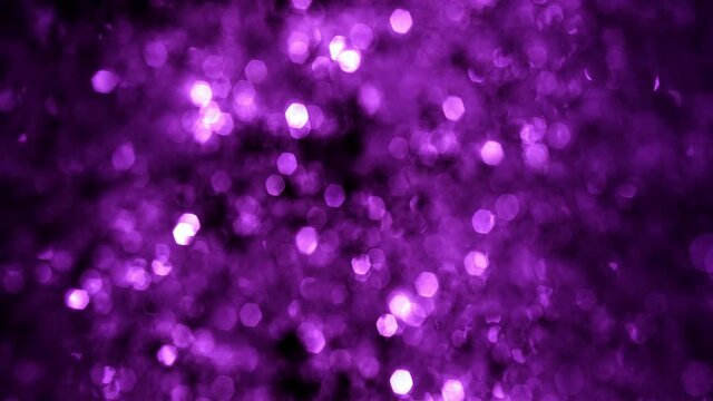 Full frame defocused and Bokeh snow and tinsel glow. Looped festive purple and white gala glitter abstract bokeh background for luxury festive and party concepts