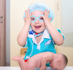 A boy with Down's syndrome plays a role-playing game, a genetically ill disabled child dressed as a...