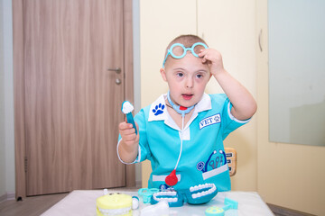 A boy with Down's syndrome plays a role-playing game, a genetically ill disabled child dressed as a...