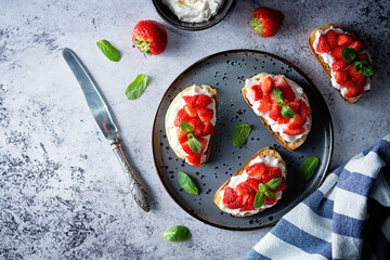 Strawberry ricotta sandwiches with mint leaves