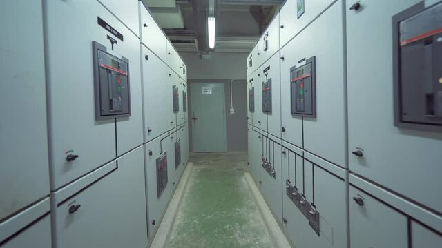 Interior of electrical room. Power energy motor machinery cabinets in control or server room, main operator station network and circuit center in industry factory manufacturing system. generator