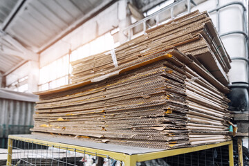 Stack prepared pile of used compressed corrugated cardboard and waste paper wrap collected for...