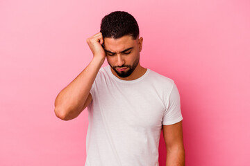 Young mixed race man isolated on pink background