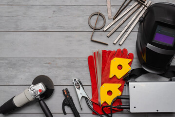 Welding concept background. Metal pieces, welding terminals, magnet holder, electrodes and welding...