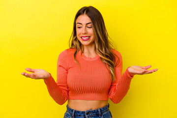 Young caucasian woman isolated on yellow background