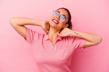 Young caucasian woman isolated on pink background