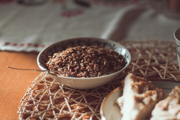 having a breakfast with muesli granola yoghurt with sweet cake on a plate