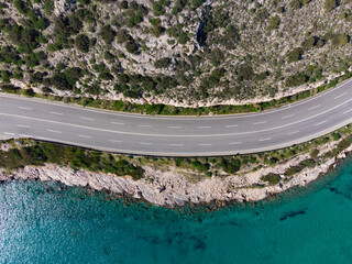 Aerial top down view of the road at Karamanli's Hole area in Agia Marina, Koropi