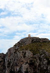 Fototapeta na wymiar Old tower on top of a mountain on the island of Mallorca, Spain