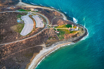 Aerial view over Long Island with Montauk Point Lighthouse and ocean in view