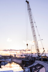 Fototapeta premium crane ladle laying pipes work construction dig city repair under water