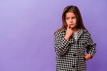 Little caucasian girl isolated on purple background Little caucasian girl isolated on purple...