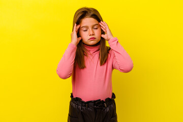 Little caucasian girl isolated on yellow background touching temples and having headache.