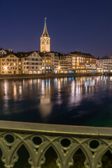 Fototapeta na wymiar View of the swiss city Zurich reflecting on the Limmat river