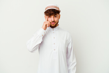 Young Arab man wearing the typical arabic costume isolated on white background pointing temple with finger, thinking, focused on a task.