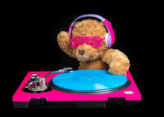 Teddy bear djing on turntables with headphones