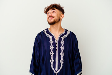 Obraz premium Young Moroccan man isolated on white background relaxed and happy laughing, neck stretched showing teeth.