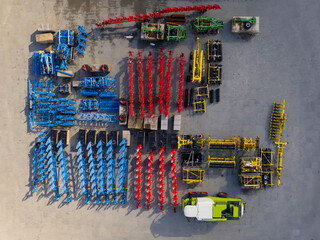 Dealer selling harvesters, parking with harvester and spare parts for it, top view 
