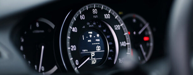 Miles Speedometer of Modern car close up. Modern car speedometer. Panoramic shot of the dashboard a...