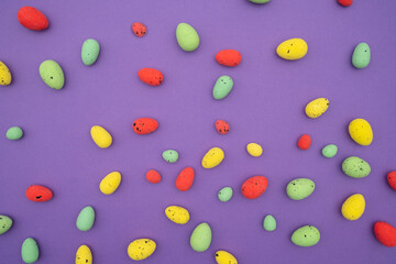 Colorful Easter eggs on purple background