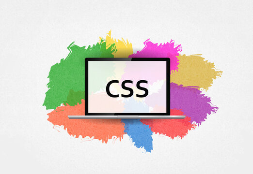 CSS. word  on laptop and colorful background