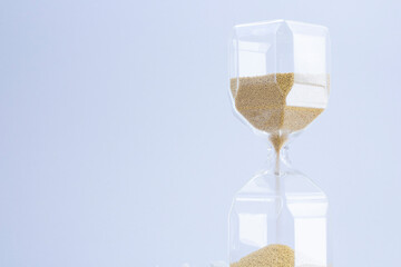 hourglass on a light gray background.