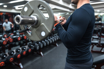 Fototapeta na wymiar Hard gym workout bodybuilding man concept