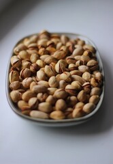 a plate with pistachios