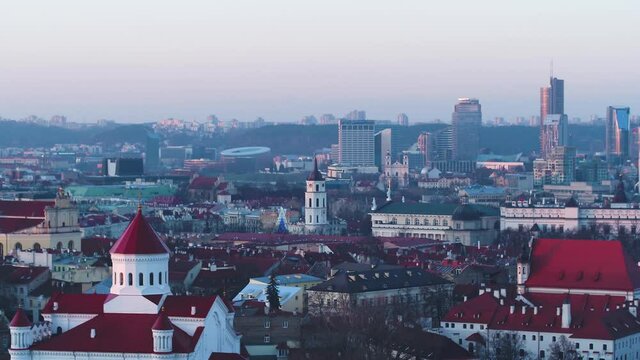 Aerial wide shot of Vilnius Old Town and skyscrapers of downtown on winter day.