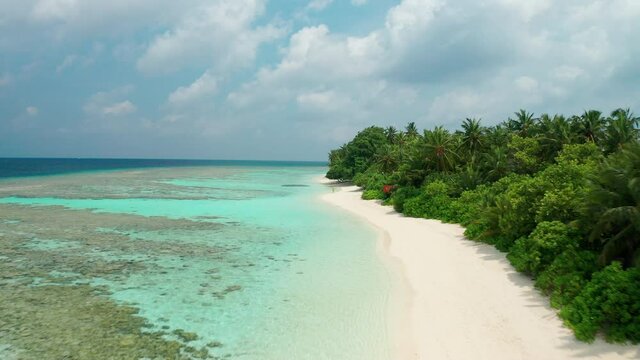Aerial view of a tropical island in the Indian Ocean. Thinadhoo (Vaavu Atoll), Maldives