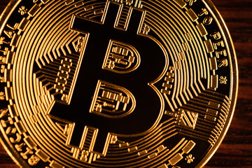 Fototapeta na wymiar Golden bitcoin coin closeup. Bitcoins. Physical bit coins. Digital currency. Cryptocurrency mining concept.