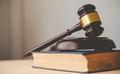 Law theme, mallet of the judge, law enforcement officers, evidence-based cases and documents taken...