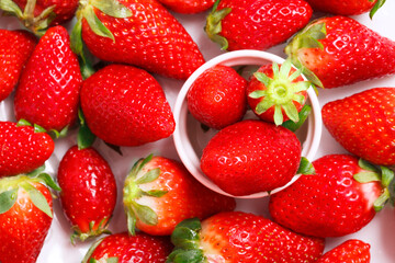 Top view of strawberries with green leaf