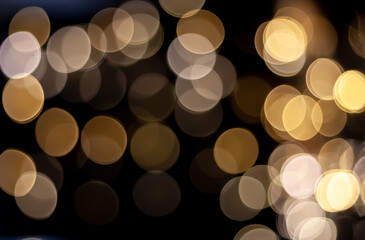 Abstract  gold and yellow glitter bokeh on circle theme background.Defocus
